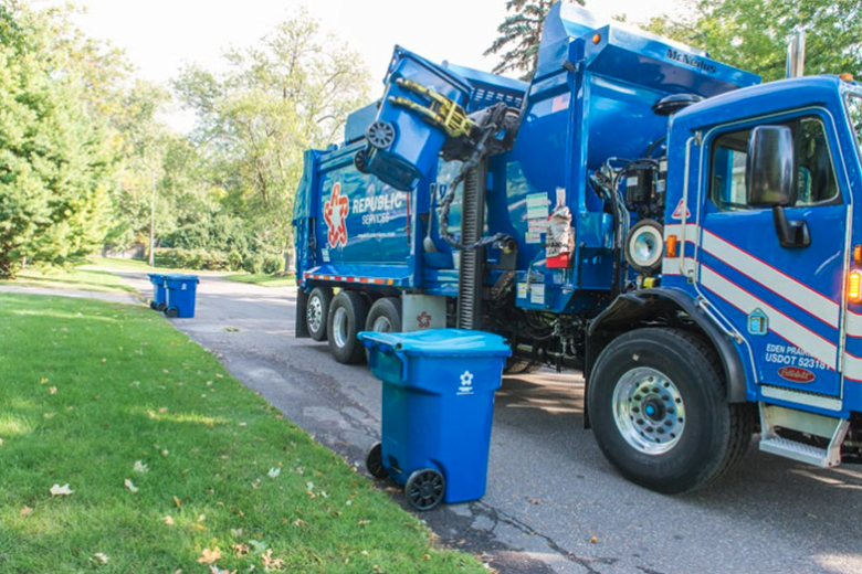 Republic Services Garbage truck picking up trash